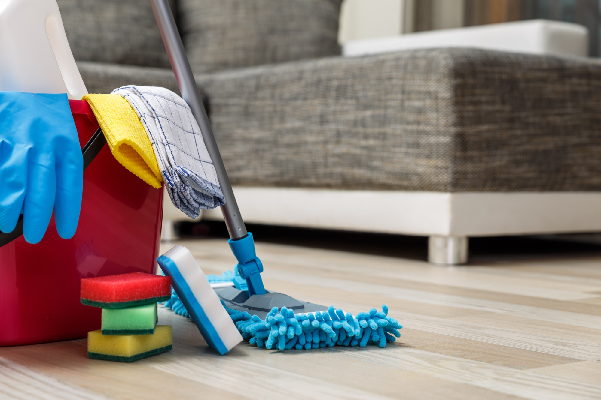 Mop, sponges, cloths and bucket ready for a residential cleaning job